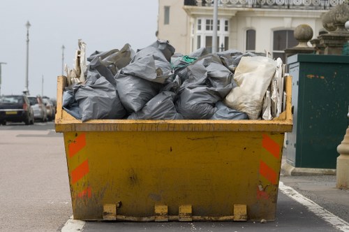 Construction site with organized waste clearance in Hayes